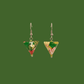 Green, pink, and gold geometric origami earrings with a floral pattern on a green background.