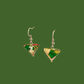 Green, pink, and gold geometric origami earrings with a floral pattern on a green background.